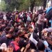 Polwan sedang membagikan roti dan air mineral kepada peserta Unjuk Rasa Menolak UU Omnibus Law