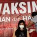 Salah satu warga saat menerima vaksin moderna.(Foto:ist)