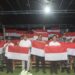 Foto: Bupati bersama unsur Forkopimda dan masyarakat mengibarkan bendera Merah Putih di Kecamatan Kepulauan Marore perbatasan Indonesia dan Filipina. (Dok. Istimewa)