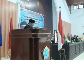 Penjabat Bupati Kepulauan Talaud Dr. Fransiscus Engelbert Manumpil, S.Pi, M.Env, Mgmt saat membacakan sambutan.
