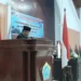 Penjabat Bupati Kepulauan Talaud Dr. Fransiscus Engelbert Manumpil, S.Pi, M.Env, Mgmt saat membacakan sambutan.