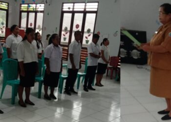 Pejabat Kepala Desa Bambung, Marhareta Andolo, S.Pd saat membacakaan surat rehabilitas kepada 7 orang Perangkat Desa Bambung.