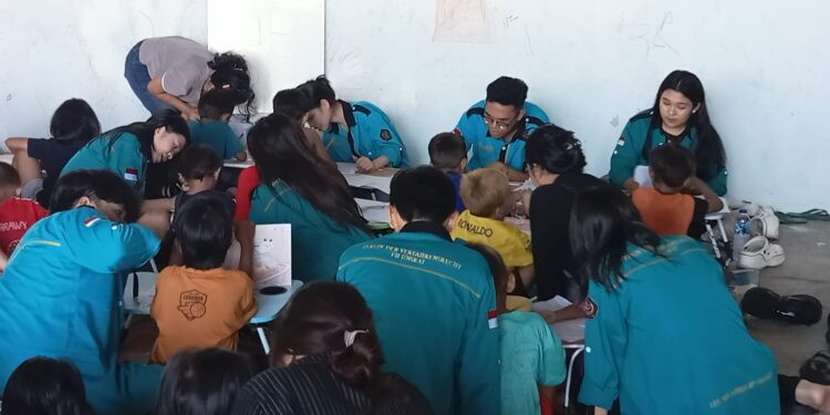 Bakti Mooters VDV FH Unsrat Hadirkan Senyum Anak-Anak Dinding Manado