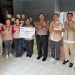 Kolaborasi PLN Sulutenggo dan Polda Sulut menyalurkan bantuan kemanusiaan untuk korban kebakaran di Kota Bitung. (foto: Humas PLN)